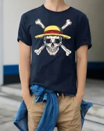 Straw Hat Pirate Skull Tee with Bold Crossbones Graphic Art - model wearing navy tee with hands in pockets
