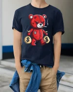 Savage Money Bear Tee with Badass Red Teddy Graphic Art - model wearing navy tee with hands in pockets
