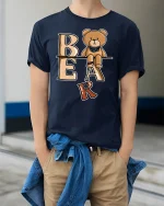 Cute Bear Letter Tee With Playful Cartoon Style Art - model wearing navy tee with hands in pockets