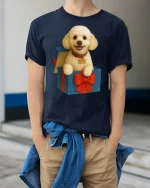 Cute Puppy In Gift Box Smiling Dog Graphic Tshirt Art - model wearing navy tee with hands in pockets