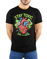 Stay Toxic Mutant Heart Cartoon Street Art Graphic T Shirt - model wearing black tee with hands behind back