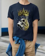Crowned Skull Dark Royal Graphic T Shirt Bold Gothic Style - model wearing navy tee with hands in pockets