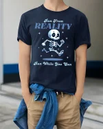 Run From Reality Funny Skeleton Graphic T Shirt With Humor - model wearing navy tee with hands in pockets
