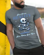 Run From Reality Funny Skeleton Graphic T Shirt With Humor - model wearing grey tee, leaning on column