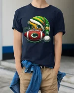 Festive Football Helmet And Ball Christmas Art Graphic T Shirt - model wearing navy tee with hands in pockets
