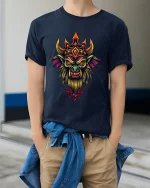 Dark Fantasy Demon King Crowned Monster Art Graphic T Shirt - model wearing navy tee with hands in pockets