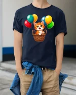 Cute Kitten With Colorful Balloons Cartoon Art Graphic T Shirt - model wearing navy tee with hands in pockets