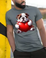 Cute Bulldog Hugging Heart Love Illustration Graphic Tee Shirt - model wearing grey tee, leaning on column