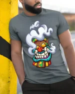 Funny Smoking Tiki Mask Cartoon Tribal Art Graphic T Shirt - model wearing grey tee, leaning on column