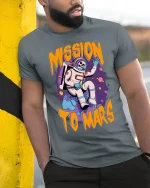 Mission To Mars Astronaut Skull Cartoon Space Graphic T Shirt - model wearing grey tee, leaning on column