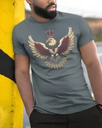 Royal Crowned Eagle Power Emblem Graphic T Shirt - model wearing grey tee, leaning on column