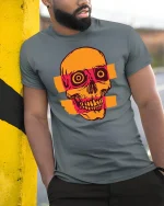 Retro Pop Art Skull Graphic T Shirt With Bold Urban Style - model wearing grey tee, leaning on column
