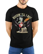 Rockin Till I Rot Skeleton Guitar Rock Music Graphic Tee Tshirt - model wearing black tee with hands behind back