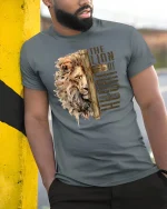 Lion Of Judah Cross Faith Inspired Christian Art Graphic Tee - model wearing grey tee, leaning on column