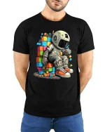 Astronaut Sitting on Colorful Blocks Space Art Graphic T Shirt - model wearing black tee with hands behind back