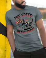 The Speed In The Arena Fierce Dinosaur Street Graphic Tee - model wearing grey tee, leaning on column