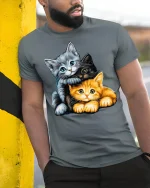 Adorable Three Kittens Cuddle Graphic T Shirt - model wearing grey tee, leaning on column