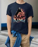 The King Lion Graphic T-Shirt Powerful Lion King Artwork Tee - model wearing navy tee with hands in pockets