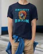 Anxiety Brain Skull Graphic T Shirt Mental Chaos Art - model wearing navy tee with hands in pockets