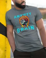 Anxiety Brain Skull Graphic T Shirt Mental Chaos Art - model wearing grey tee, leaning on column