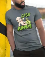 Funny Cash Junkie Money Voodoo Doll Cartoon Graphic T Shirt - model wearing grey tee, leaning on column