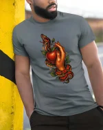 Snake And Apple Temptation Dark Tattoo Style Graphic T Shirt - model wearing grey tee, leaning on column