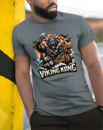 Viking Kong Warrior Graphic T Shirt Epic Norse Monster Style - model wearing grey tee, leaning on column