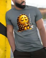 Sick Emoji Wrapped In Blanket Funny Graphic T Shirt - model wearing grey tee, leaning on column