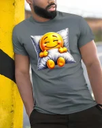 Sleepy Smiling Emoji T-Shirt Cozy Pillow Cute Tee - model wearing grey tee, leaning on column