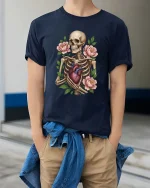 Skeleton Holding Heart With Flowers Graphic T Shirt Gothic Art - model wearing navy tee with hands in pockets