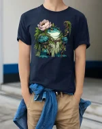Frog Forest Druid Cartoon Graphic T Shirt Nature Fantasy Style - model wearing navy tee with hands in pockets