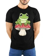 Happy Frog Sitting Mushroom Cartoon Graphic T Shirt Fun Vibe - model wearing black tee with hands behind back
