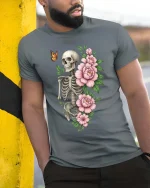Skull and Flowers Butterfly Dark Aesthetic Graphic Tee - model wearing grey tee, leaning on column