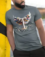Elegant Letter T With Angel Wings Graphic T Shirt Tee - model wearing grey tee, leaning on column