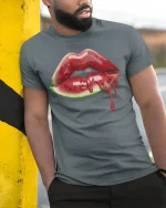 Watermelon Lips Drip Art Graphic T Shirt Tee - model wearing grey tee, leaning on column