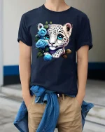 Cute Snow Leopard Cub Blue Roses Graphic T Shirt Design - model wearing navy tee with hands in pockets