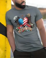 Memorial Day Patriotic Heart Flag Tribute Graphic T Shirt - model wearing grey tee, leaning on column