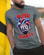 I Bleed New York Giants Football Fan Graphic T Shirt - model wearing grey tee, leaning on column