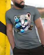 Cute Snow Leopard Cub Blue Roses Graphic T Shirt Design - model wearing grey tee, leaning on column