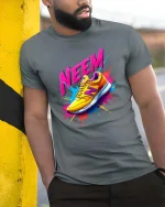 NEEM Sneaker Splash Colorful Street Style Graphic T Shirt - model wearing grey tee, leaning on column