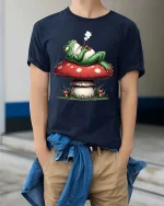 Chill Frog Smoking on Mushroom Funny Graphic T Shirt Vibes - model wearing navy tee with hands in pockets