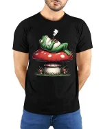 Chill Frog Smoking on Mushroom Funny Graphic T Shirt Vibes - model wearing black tee with hands behind back
