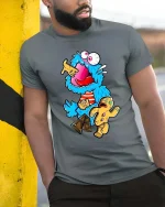 Crazy Blue Monster Cookie Candy Funny Graphic T Shirt Cartoon - model wearing grey tee, leaning on column