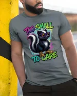 Too Small To Care Funny Skunk Cool Graphic T Shirt Attitude - model wearing grey tee, leaning on column