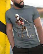 Creepy Dancing Skeleton T Shirt Spooky Glow Ribcage Tee - model wearing grey tee, leaning on column
