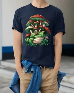 Cute Frog Mushroom T Shirt Fantasy Nature Cartoon Graphic Tee - model wearing navy tee with hands in pockets