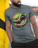 Crazy One Eye Monster Slime Cartoon Graphic T Shirt - model wearing grey tee, leaning on column