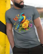 Colorful Bird And Butterfly Floral Graphic T Shirt Nature Art - model wearing grey tee, leaning on column