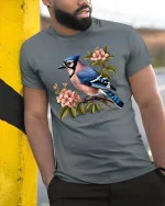 Blue Jay Bird Blossom Graphic T Shirt Elegant Nature Art Tee - model wearing grey tee, leaning on column