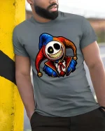 Creepy Smiling Jester Skull Graphic T Shirt Dark Humor Tee - model wearing grey tee, leaning on column